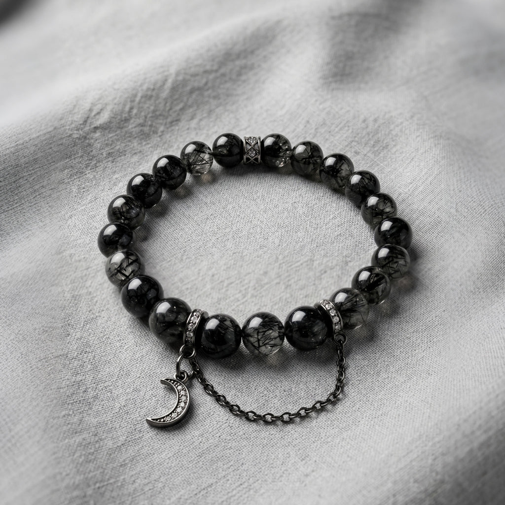 Black Rutilated Quartz Energy Bracelet - Clear crystal beads displaying intricate deep black needle-like inclusions