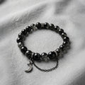 Black Rutilated Quartz Energy Bracelet - Clear crystal beads displaying intricate deep black needle-like inclusions