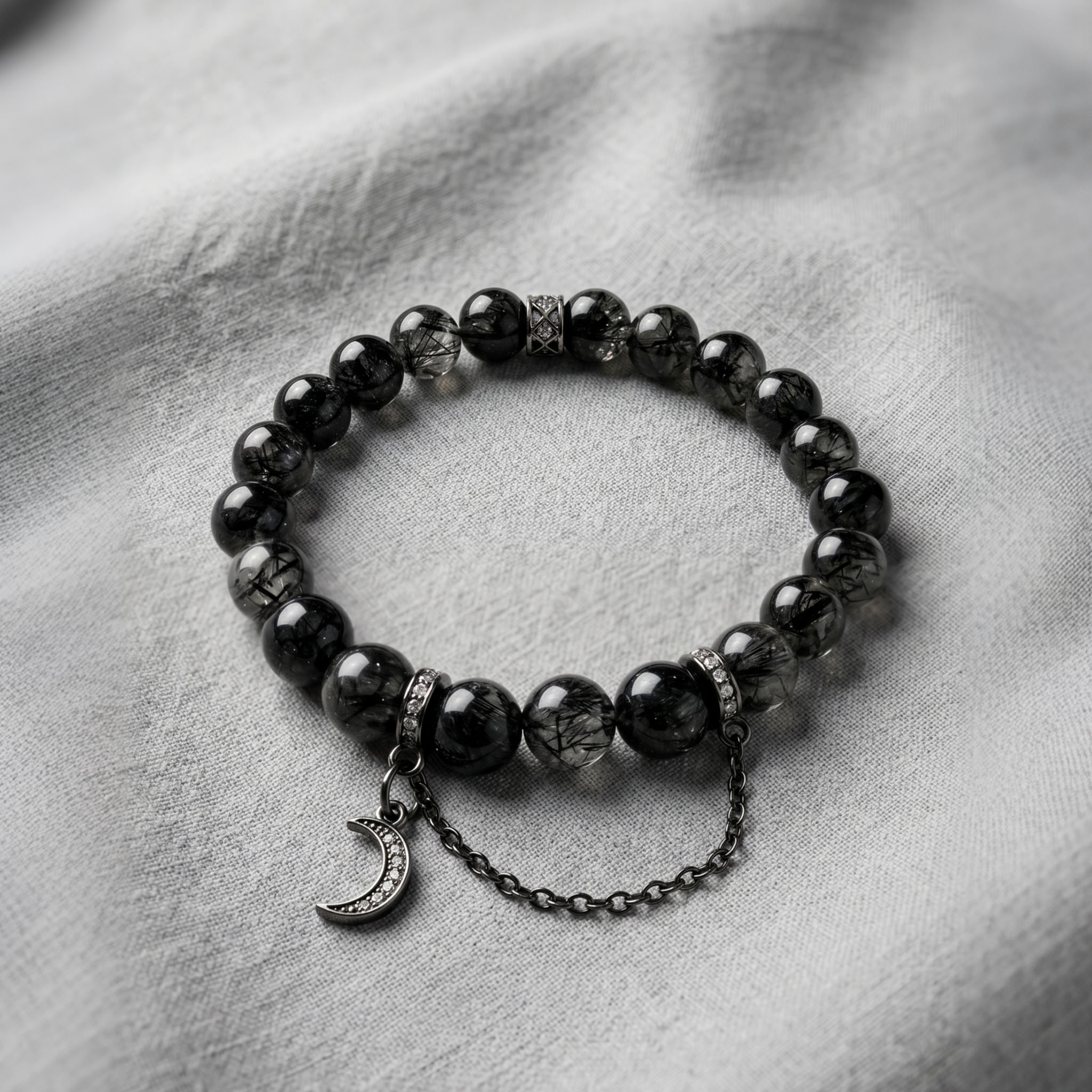 Black Rutilated Quartz Energy Bracelet - Clear crystal beads displaying intricate deep black needle-like inclusions