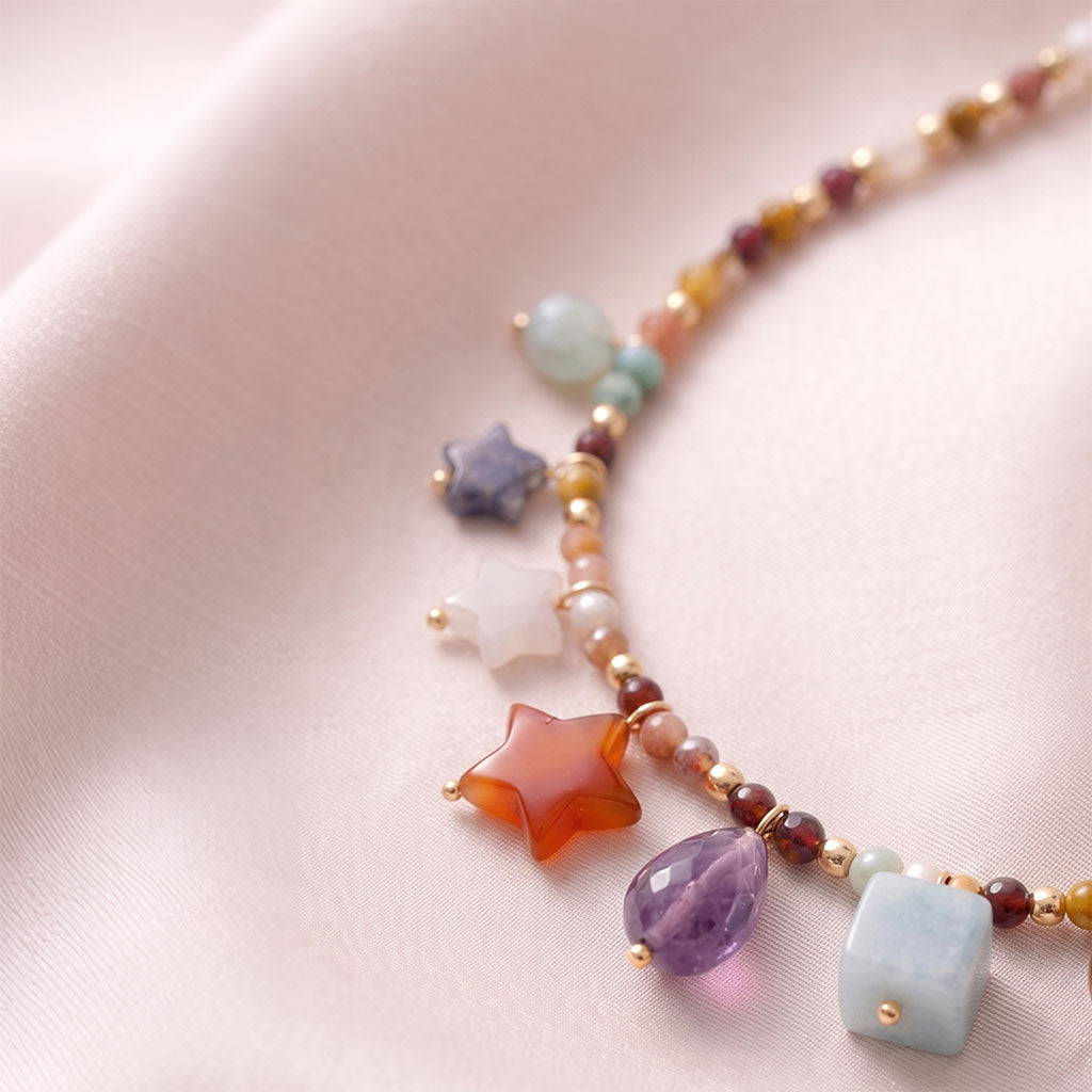 Close-up details of the Celestial Crystal Charm Necklace pendant.
