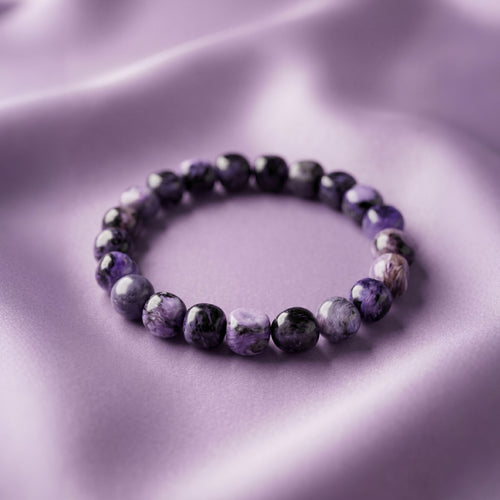 Charoite Energy Bracelet - Polished natural stones showcasing unique swirling patterns of purple and white luster