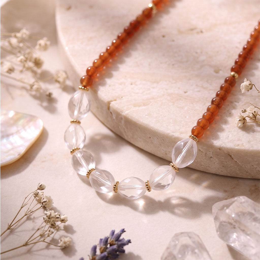 Close-up of Garnet and Clear Quartz crystal beads with gold accents