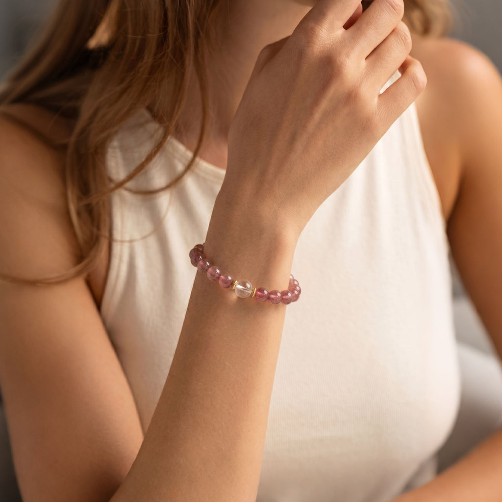 Model wearing Strawberry quartz energy bracelet 